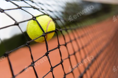 Preview: Tennis Ball Bouncing On The Net At A Clay Court