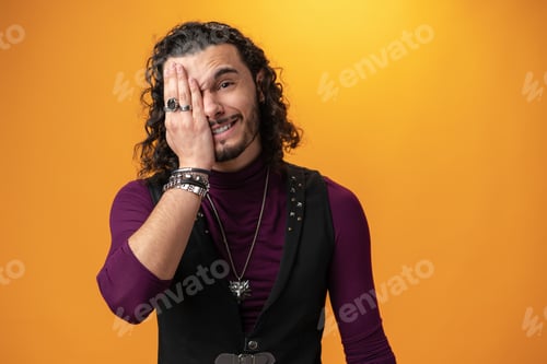 Preview: Frustrated young man failing, feeling upset portrait against yellow background