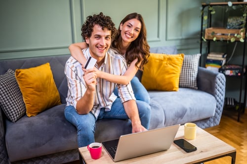 Couple shopping online at home