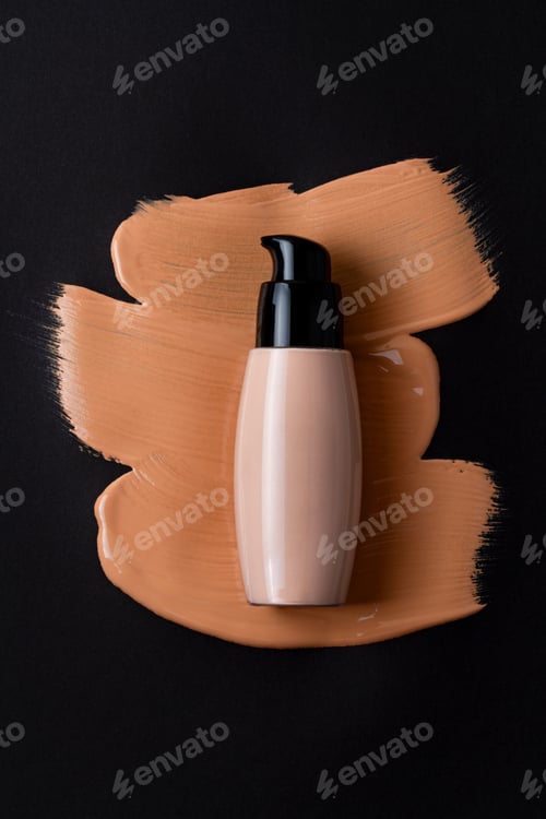 Preview: Mockup with make up face foundation bottle and smudged drop of concealer