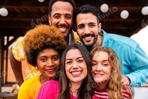 Preview: Multiethnic group of friends having dinner barbecue party on rooftop at home