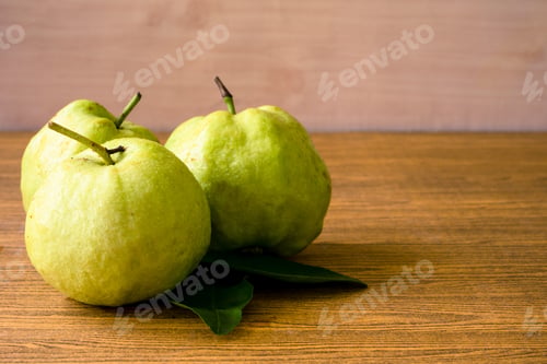 Preview: Fresh guava fruit on wooden table background.