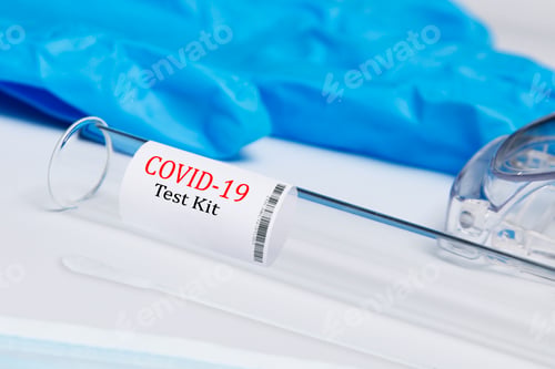 Preview: Closeup of a covid-19 test kit on a white table background