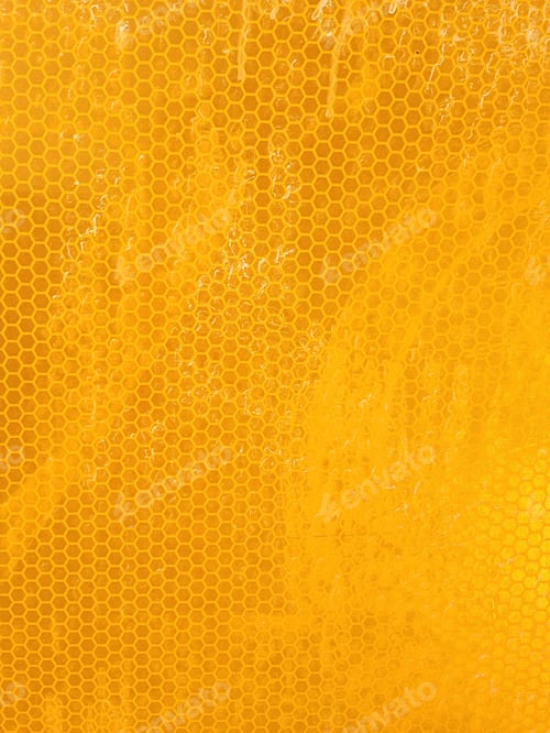 Preview: close up of a yellow reflective surface, cat eye