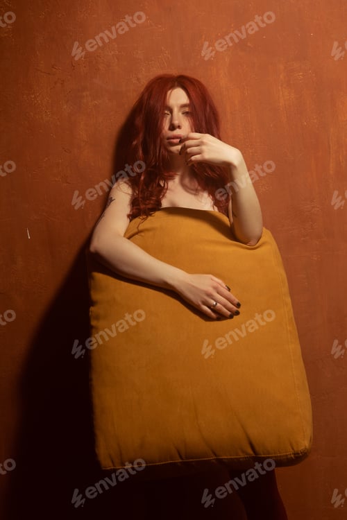 Preview: Beautiful Girl With Red Hair, Makeup And Styling. Red Flowers In The Hands