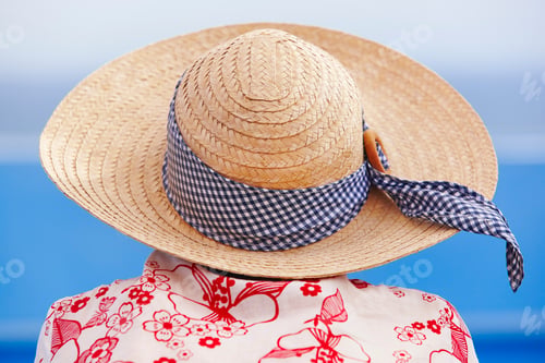 Preview: Summer time. Woman with hat and blue background. Relaxing time