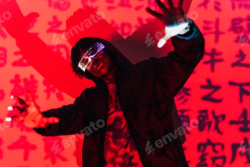 Preview: Cool man with augmented reality goggles dancing