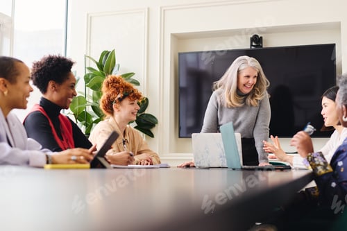 Preview: Portrait of senior white businesswoman with laptop smiling and l