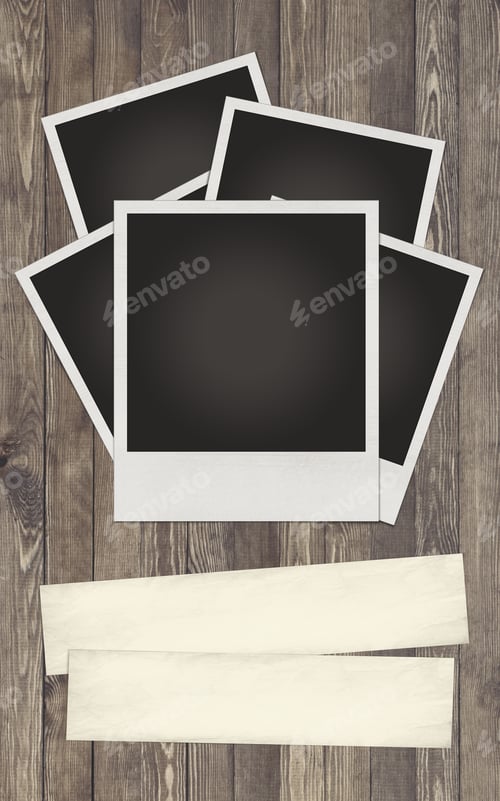 Preview: Blank photo frame on wood background