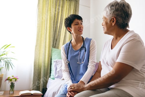 Preview: Caring Woman Doctor Talking With Senior Woman