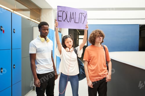 Preview: Group of students carrying a banner at school protesting for equality.