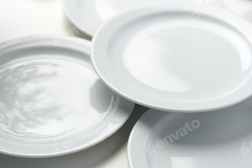 Preview: Set of white dinner plates on white background