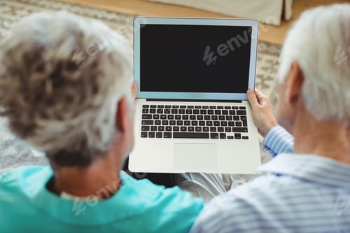 Preview: Senior couple using laptop
