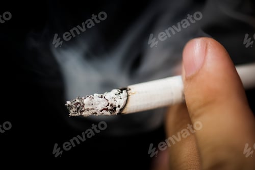 Preview: Closeup of hand holding cigarr