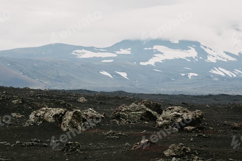 Preview: majestic icelandic landscape with snow-capped mountains and rocks