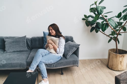 Preview: Frustrated woman crying on sofa