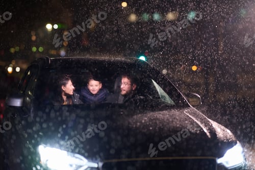 Preview: In the midst of a nighttime journey, a happy family enjoys playful moments inside a car as they