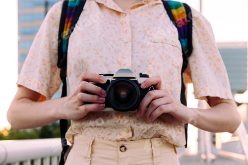 Preview: close-up of the hands with a camera of photos