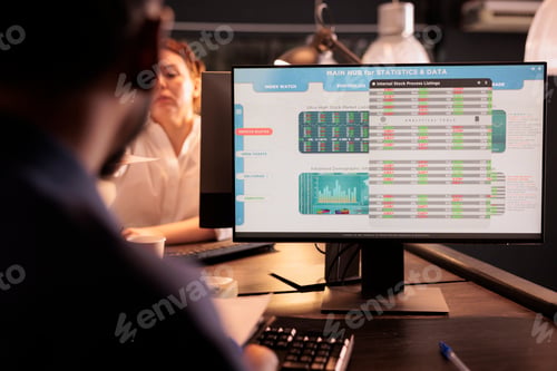 Preview: Employee analyzing trading stock market using analytics software