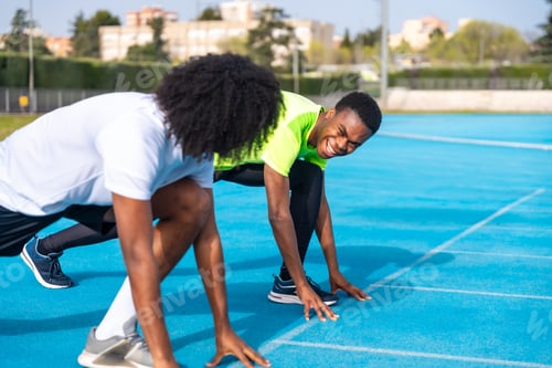 Preview: African athletes in starting position on an athletics track
