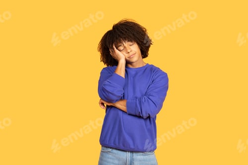 Preview: Hipster young man expressing contemplation in a vibrant background