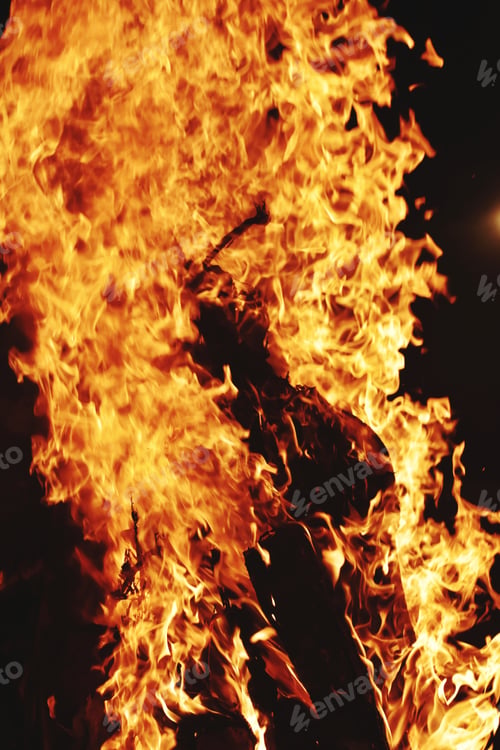 Preview: Vertical closeup shot of campfire at the time of festival
