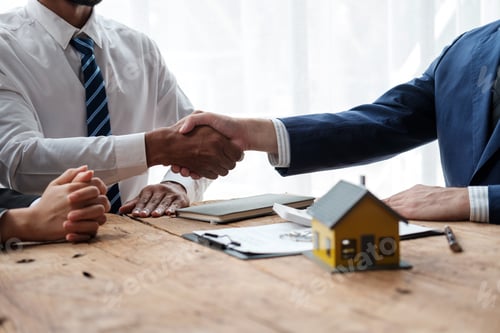 Preview: Residential house businessman banker shake hand with customer after successful agreement and signin