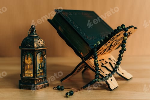 Preview: Traditional Ramadan lantern with prayer beads on bright wooden background