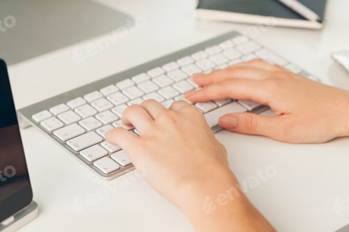 Preview: Close up of a female hands of woman office worker typing on the keyboard