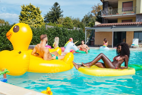 Preview: Friends having fun in a swimming pool