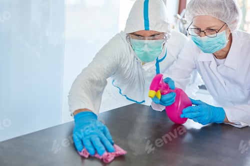 Preview: Cleaners With Protective Clothing Clean And Disinfect Surfaces In A Clinic During The Covid-19