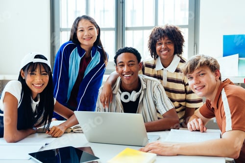 Preview: Multiethnic students studying together smiling at library