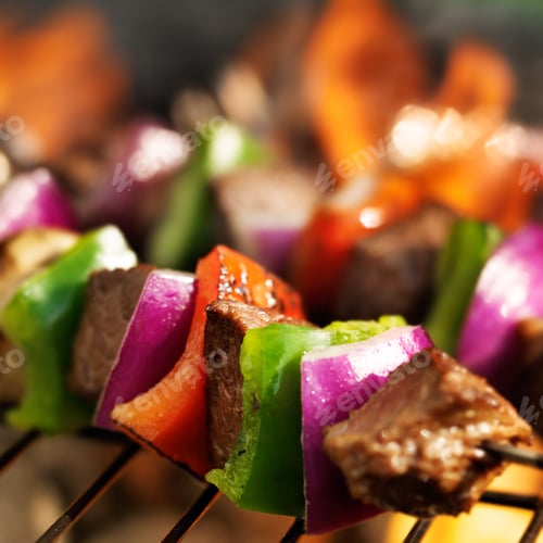 Preview: beef shish kebabs skewers cooking on grill with flames