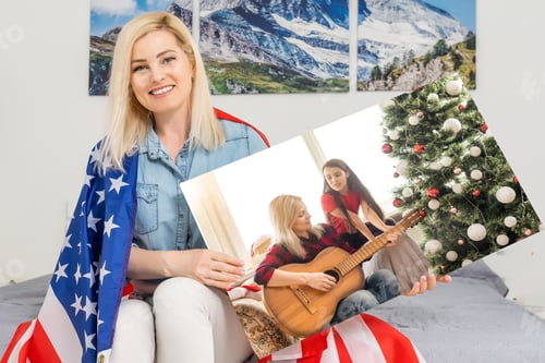 Preview: woman holding a photo canvas with a picture of christmas.