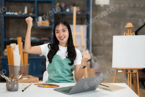 Preview: Artistic young woman working on a new painting.