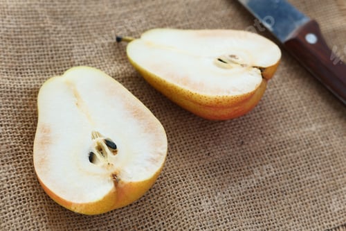 Preview: slice of fresh pears on table close up