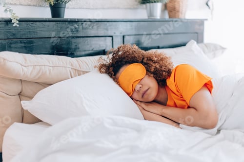 Preview: young woman sleeping comfortable in hotel bedroom