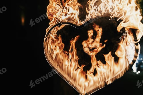 Preview: heart shaped firework on black background, fire show in night