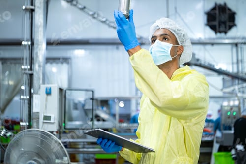Preview: Quality control officers inspect the can conveyor system