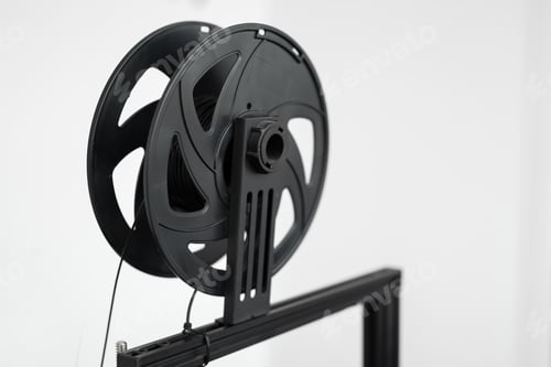 Preview: Black filament on a 3D printer in the lab