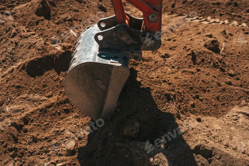 Preview: Excavator shovel digging on dirt
