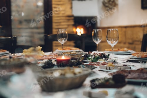 Preview: Closeup shot of a delicious dinner table with wine glasses