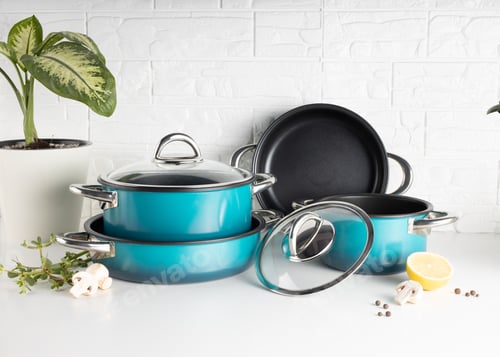 Preview: Metallic cooking pots and trays in a white background.