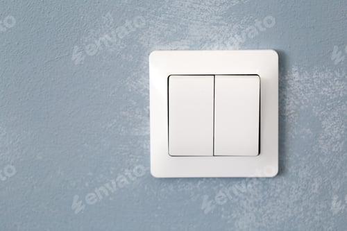 Preview: Light switch on a textured blue wall in a modern interior setting