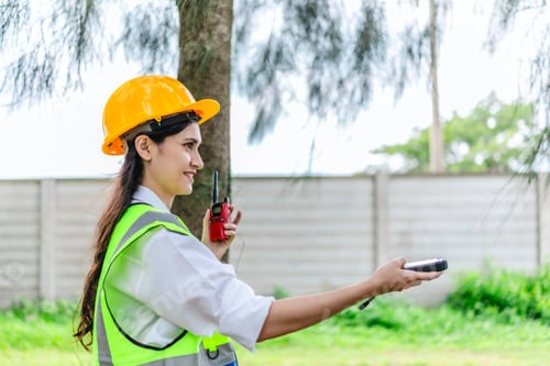 Preview: Female Environmental Surveyor Using GPS Land Meter in Forest