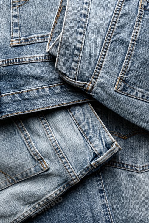 Preview: Group of aged blue denim jeans