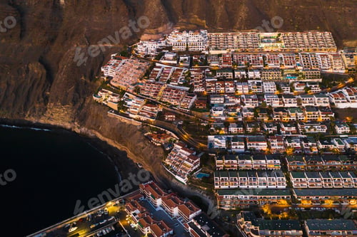 Preview: Top view of the houses located on the rock of Los Gigantes at sunset, Tenerife, Canary Islands