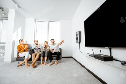Preview: Friends watching TV at home