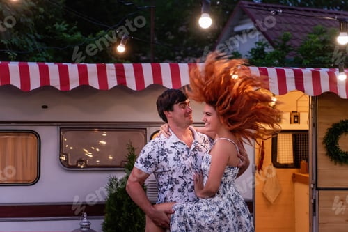 Preview: Middle-aged couple are dancing in love at the motor house in the evening.