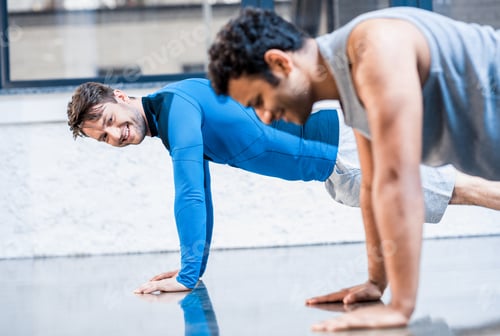 Preview: young men doing push-up at sports center
